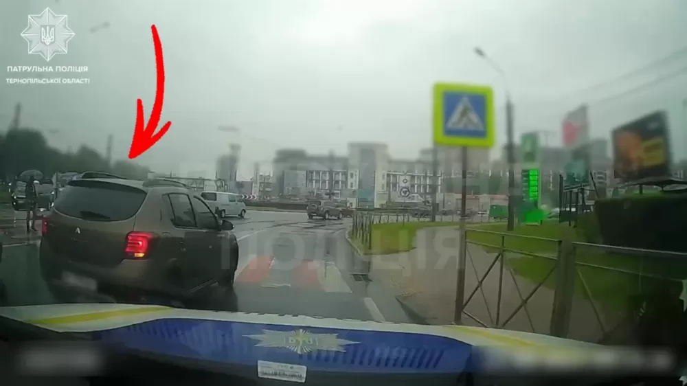 водій